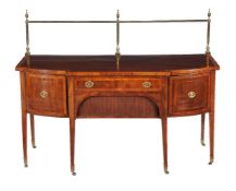 ϒ A George III mahogany, satinwood and tulipwood banded sideboard