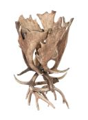 A fallow deer antler formed jardiniere stand