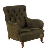 A late Victorian mahogany and upholstered armchair