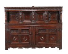 A carved oak court cupboard