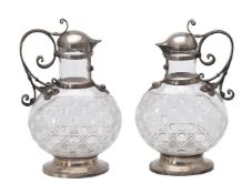 A pair of late 19th century French silver mounted cut glass claret jugs by Désiré Jouannet