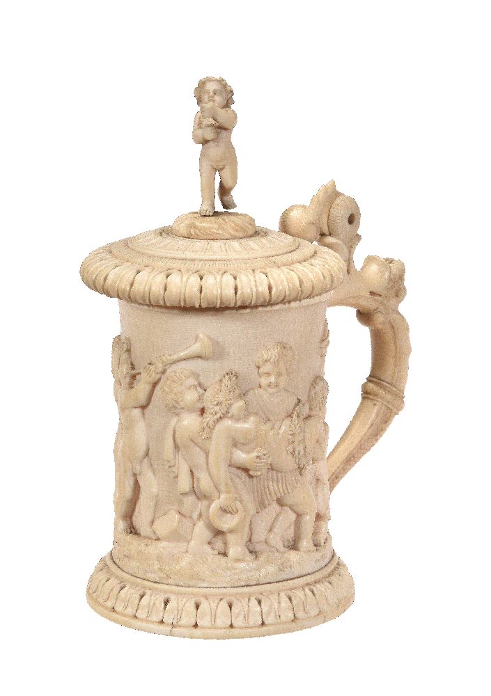 ϒ A Continental carved ivory tankard in Renaissance Revival taste