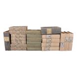 A group of approximately fifty decorated fibreboard filing boxes modelled as volumes
