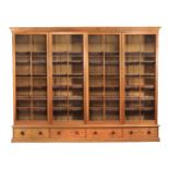 A large pitch pine and glazed bookcase in Victorian style