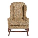 A wing armchair in 18th century style
