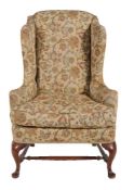 A wing armchair in 18th century style