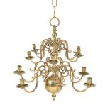 A Dutch brass twelve light chandelier
