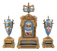 A gilt metal and blue Sevres style porcelain clock garniture