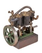 A vintage model of a live steam compound two cylinder vertical engine