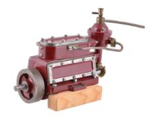 A well-engineered and unusual model of a three cylinder live steam enclosed crank marine engine