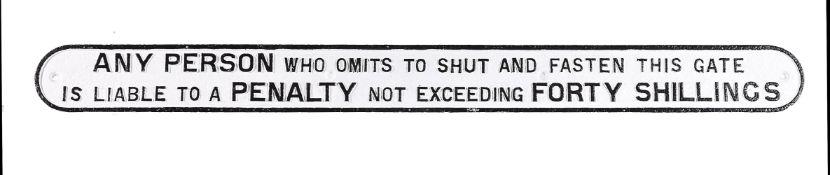 A cast-iron railway penalty 'shut the gate' sign