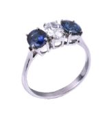 A sapphire and diamond three stone ring