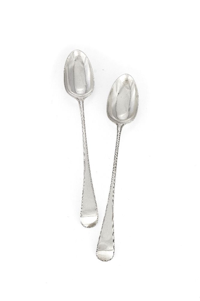 A pair of George III old English beaded pattern gravy spoons by Richard Crossley