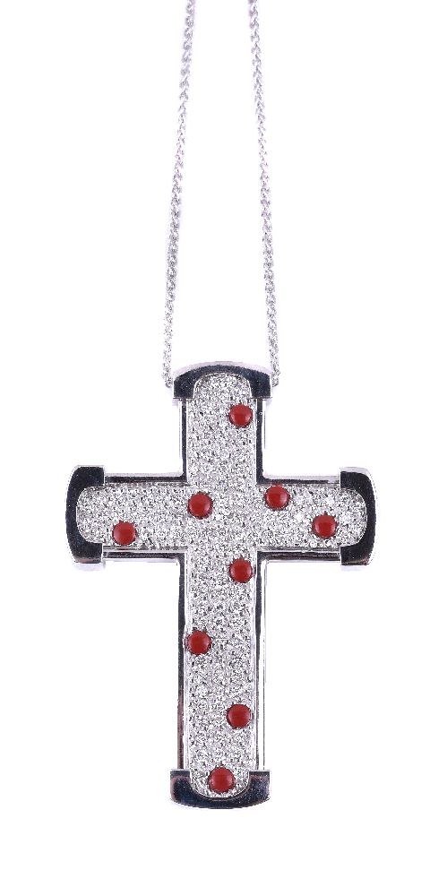 ϒ A diamond and coral cross pendant