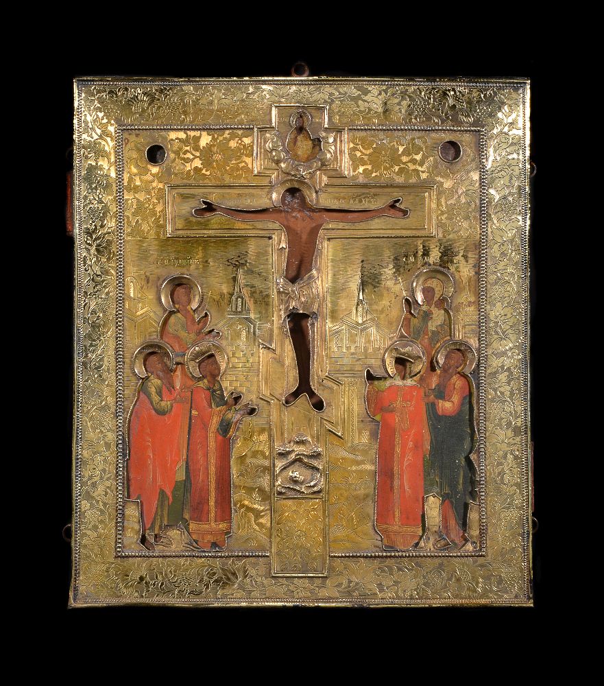 A late 18th century Russian icon of the Crucifixion with a silver gilt oklad