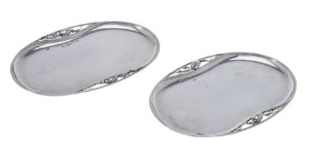 Georg Jensen, a pair of Danish silver Blossom pattern trays