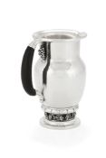 ϒ Georg Jensen, a Danish silver Grape pattern pitcher or jug