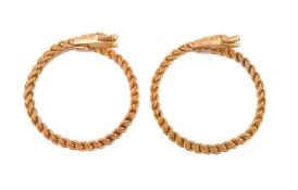 A pair of 1960s gold coloured serpent bangles
