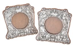 A pair of Edwardian silver photograph frames by William Comyns & Sons