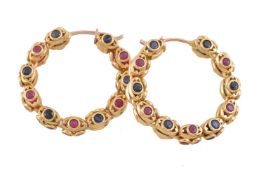 A pair of ruby and sapphire ear hoops