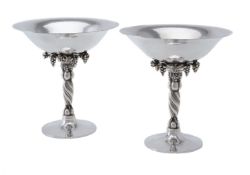 Georg Jensen, a pair of Danish silver Grape pattern pedestal bowls