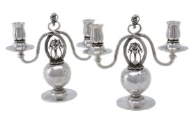 Georg Jensen, a pair of Danish silver twin light candelabra