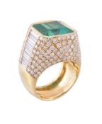 An emerald and diamond dress ring