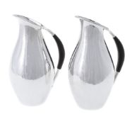 ϒ Georg Jensen, a pair of Danish silver water jugs or pitchers