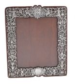 A Victorian silver photograph frame by William Comyns & Sons
