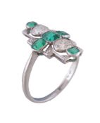 A mid 20th century diamond and emerald panel ring