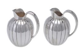 Georg Jensen, a pair of Danish silver Bernadotte cream jugs or pitchers