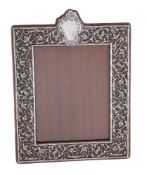 An Edwardian silver photograph frame by The Goldsmiths & Silversmiths Co. Ltd
