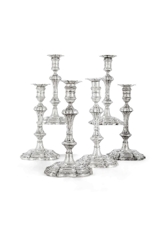 A matched set of six cast silver candlesticks by James Robinson Inc.