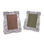 A matched pair of Arts and Crafts silver photograph frames