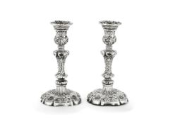 A pair of William IV silver shaped circular candlesticks by John Settle & Henry Wilkinson