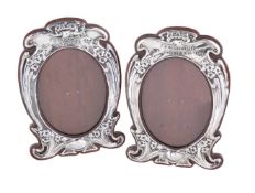 A pair of Arts and Crafts silver photograph frames by J. Aitkin & Son