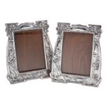 A pair of Arts and Crafts silver photograph frames by Charles S. Green & Co.