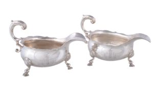 A pair of George II silver oval sauceboats by Henry Brind