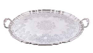 A Victorian silver shaped oval twin handled tray by Garrard & Co.