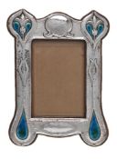 An Arts and Crafts silver and enamel photograph frame by Deakin & Francis