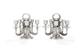 Georg Jensen, a pair of Danish silver Grape pattern candelabra