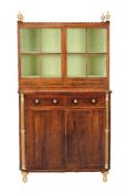 ϒ A Regency rosewood and parcel gilt cabinet bookcase