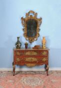 A Venetian painted and parcel gilt serpentine commode