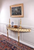 A George III satinwood, painted and parcel gilt console table