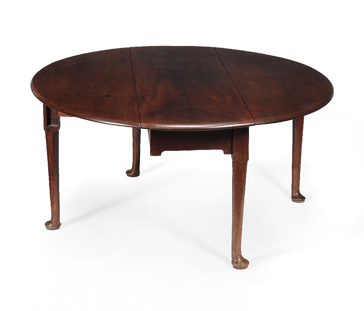 A George II mahogany oval drop leaf dining table