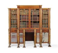 A Regency mahogany and parcel gilt breakfront library bookcase