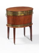 A George III mahogany and brass bound oval wine cooler