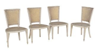 A set of four George III cream painted side chairs