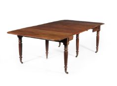 A George IV mahogany concertina action extending dining table