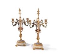 A pair of French gilt metal, onyx and champlevé enamel four light candelabra